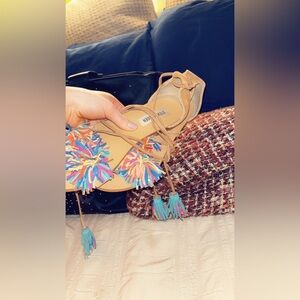 Steve Madden’s flat sandals what colorful tassels